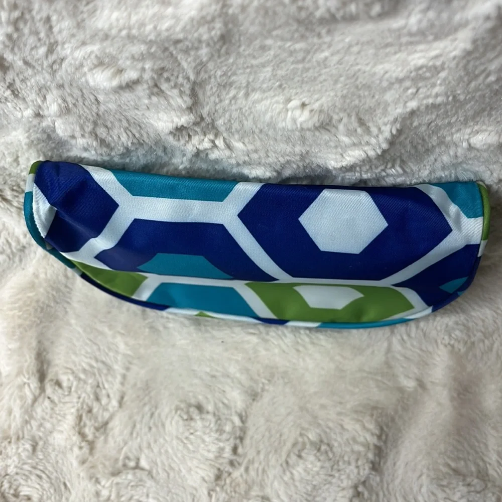Small cosmetic bag with zip top closure.